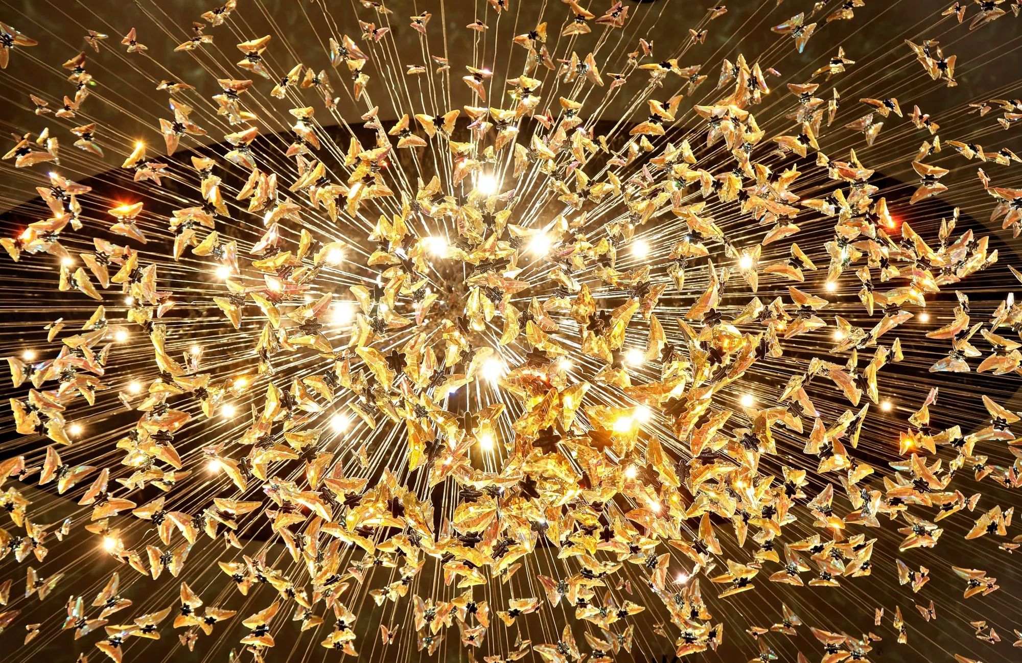 Chandelier of golden glass birds
